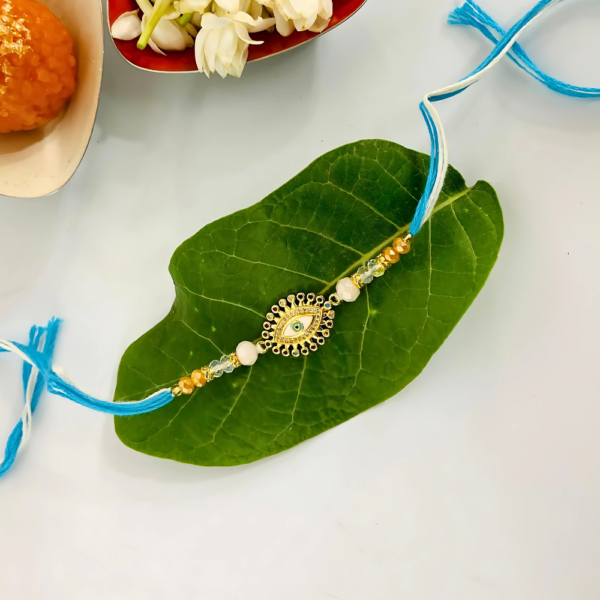 Evil Eye Rakhi for Brother - Sky Blue Thread with Golden Charm